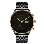 Pharaoh watch featuring a black dial, gold accents, and a black metal bracelet on a red background.