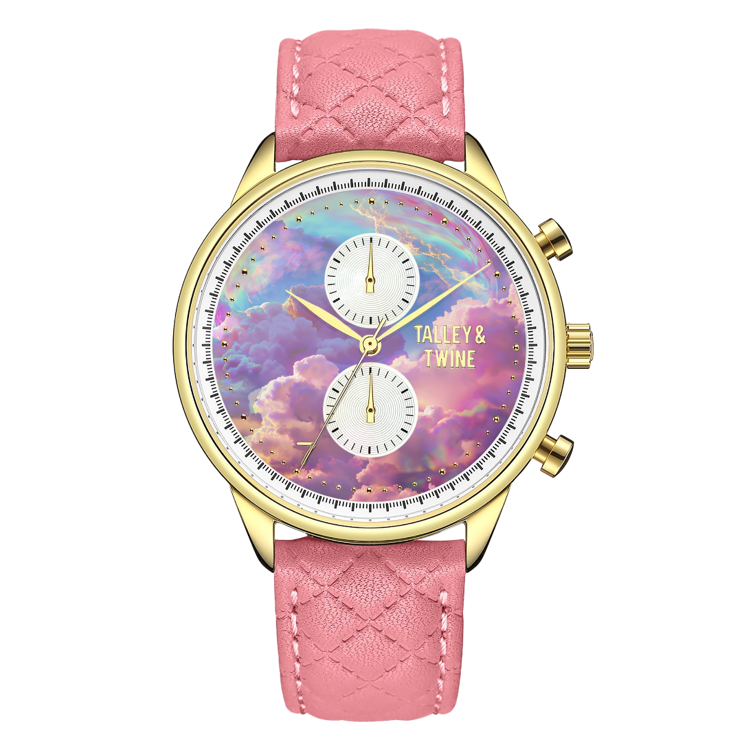 Pink unicorn watch with a gold case, pastel cloud dial, and pink quilted leather strap.